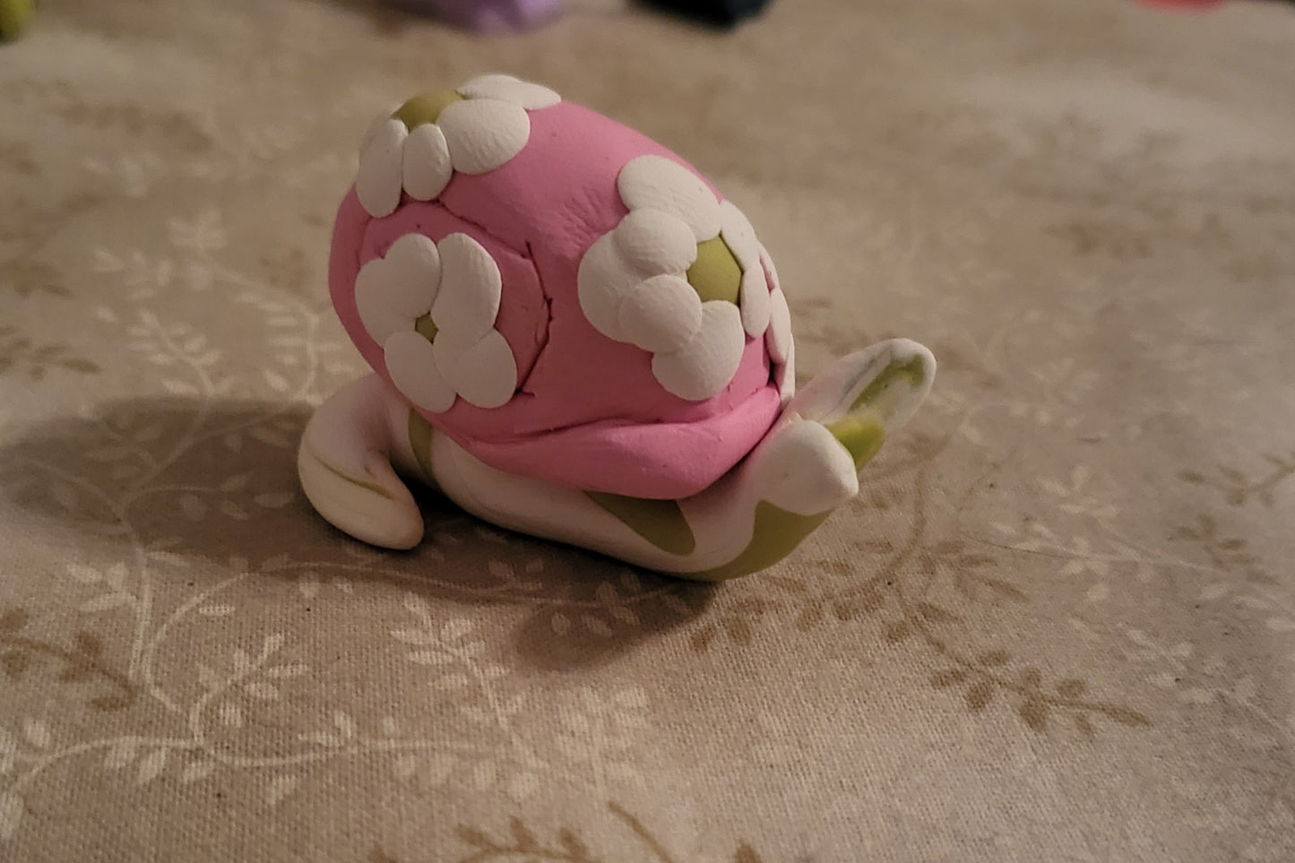 2" Daisy Snail Clay Figurine